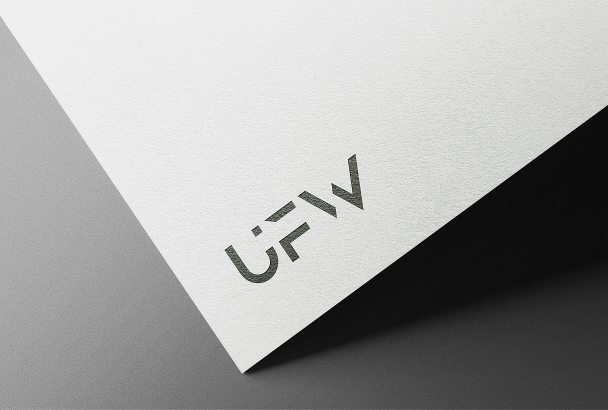 Unfolloworld branding by Reform Digital, logo mockup on paper